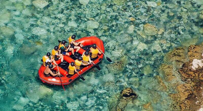 Rafting in shallow river.