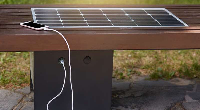 Solar phone charger on a bench.