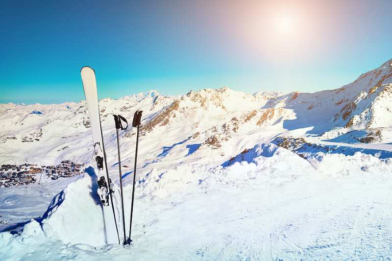 Standing skiis on a sunny day in the Alps.